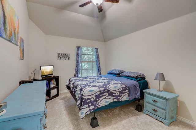 bedroom featuring light colored carpet, lofted ceiling, and ceiling fan