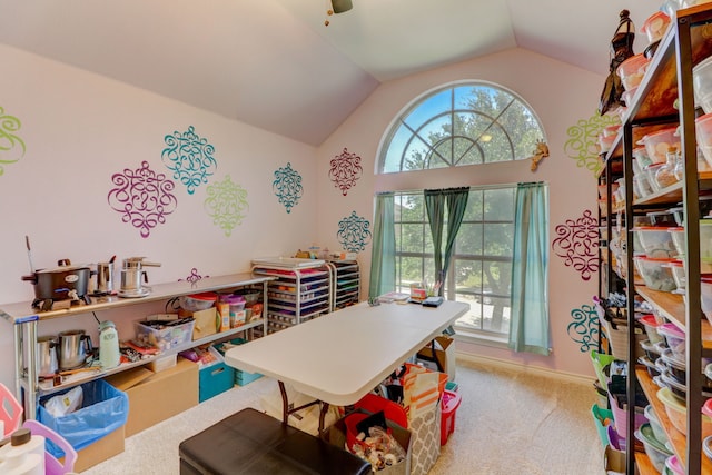 recreation room featuring vaulted ceiling and carpet