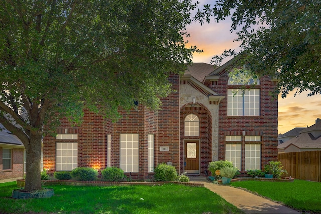 view of front of home with a lawn