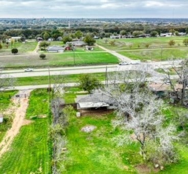 birds eye view of property featuring a rural view