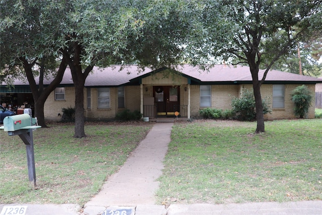 ranch-style house with a front yard