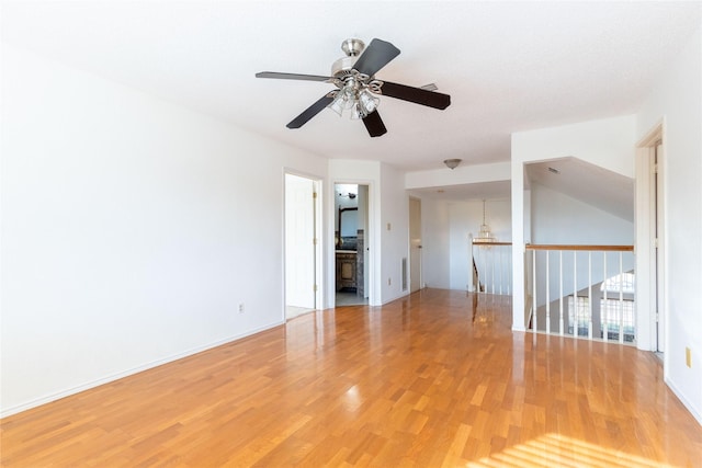 spare room with hardwood / wood-style flooring and ceiling fan