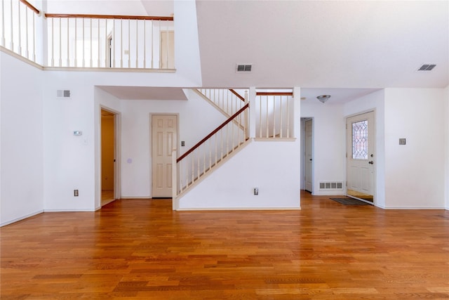 unfurnished living room with hardwood / wood-style floors