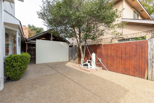 view of side of home with a patio