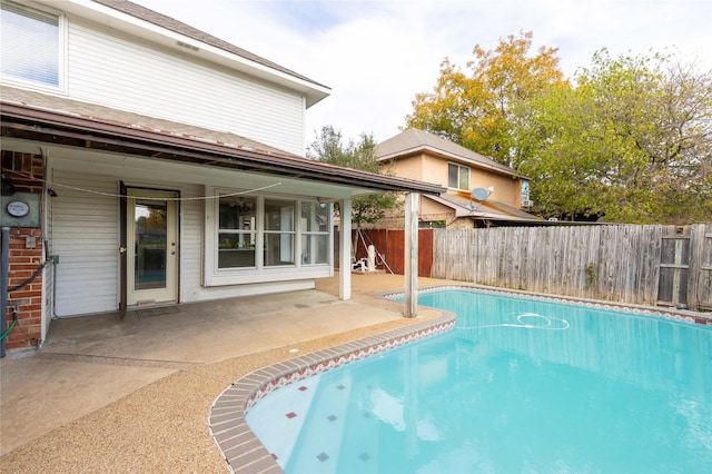 view of swimming pool with a patio area