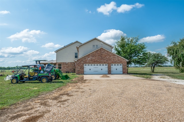 view of front of home with a garage and a front yard