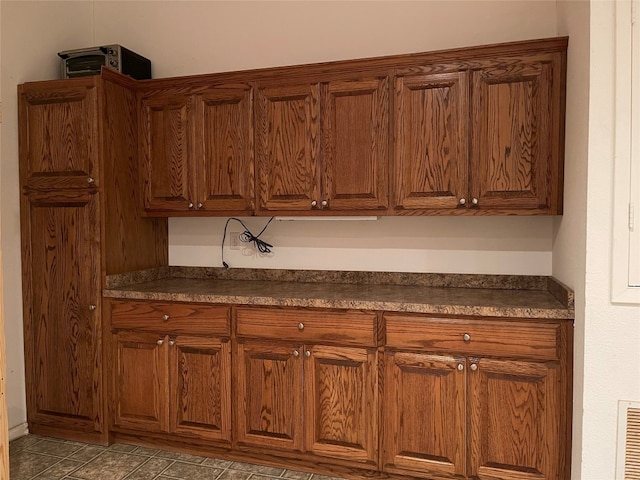 kitchen featuring light tile floors