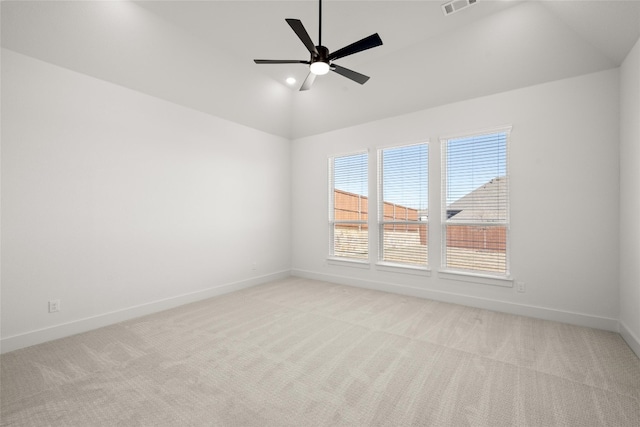 carpeted empty room featuring lofted ceiling and ceiling fan