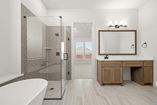 bathroom featuring shower with separate bathtub, tile flooring, and vanity