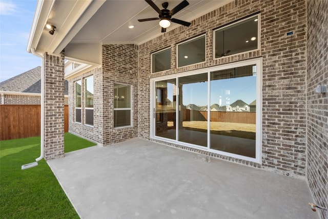 view of patio featuring ceiling fan