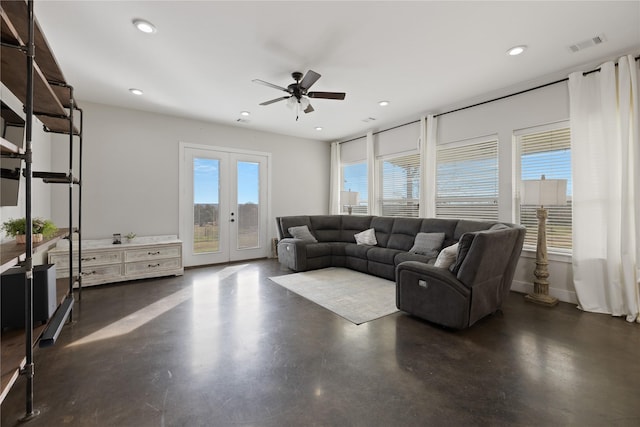 living room with ceiling fan and french doors