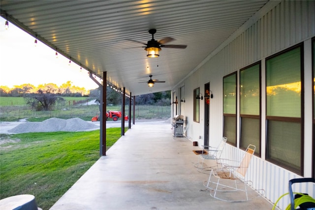 view of patio featuring ceiling fan