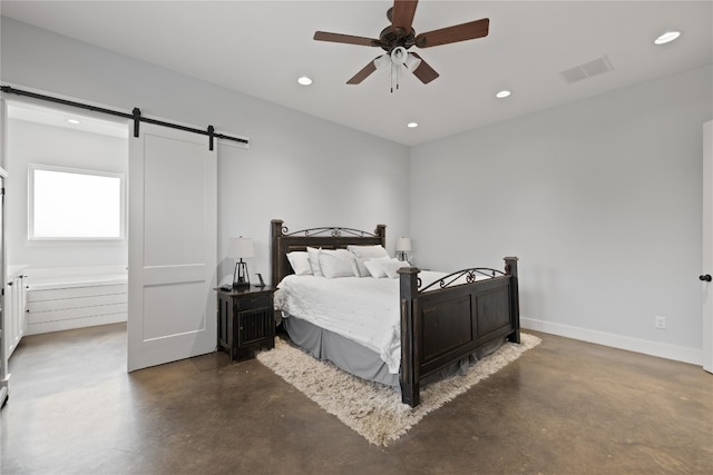 bedroom featuring ceiling fan and a barn door