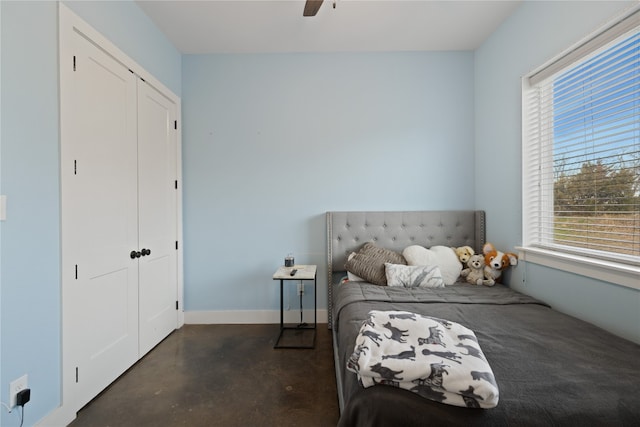 bedroom with multiple windows, a closet, and ceiling fan