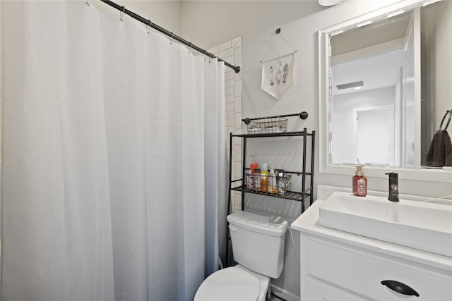 bathroom with a shower with curtain, vanity, and toilet