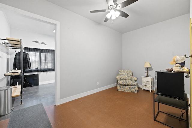 living area with ceiling fan