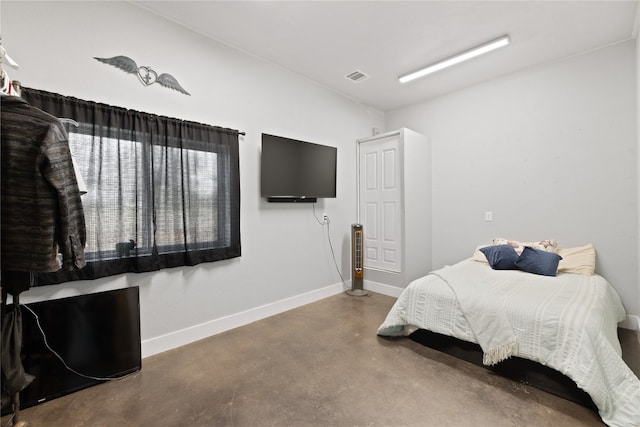 bedroom with concrete flooring