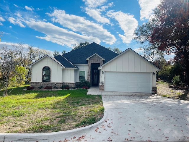 ranch-style house with a garage and a front lawn