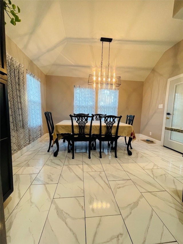 dining area with light tile patterned flooring, lofted ceiling, and a notable chandelier