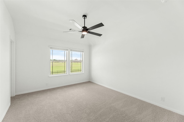 carpeted empty room featuring ceiling fan