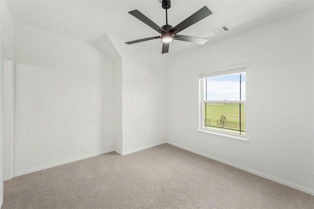 empty room with ceiling fan and carpet floors