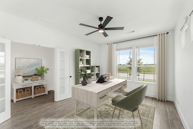 home office with french doors and ceiling fan