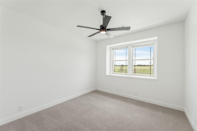 spare room with carpet floors and ceiling fan