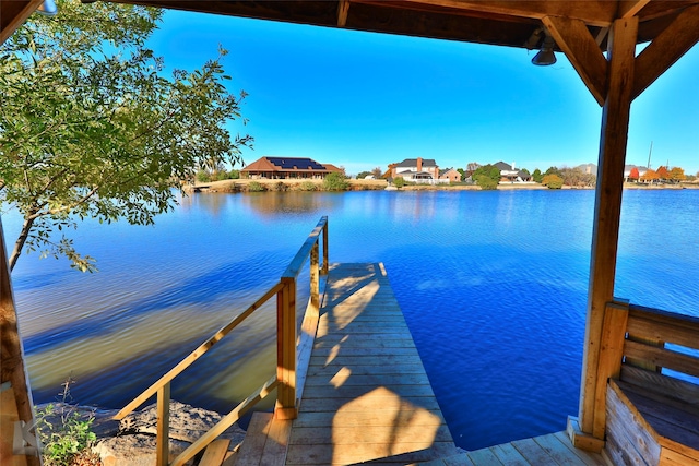 dock area featuring a water view