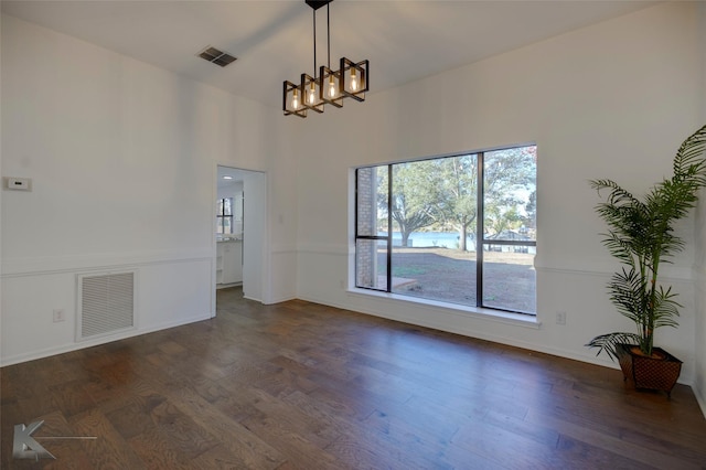 unfurnished dining area with dark hardwood / wood-style floors