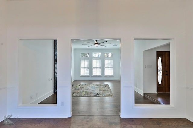 interior space featuring ceiling fan and dark hardwood / wood-style floors