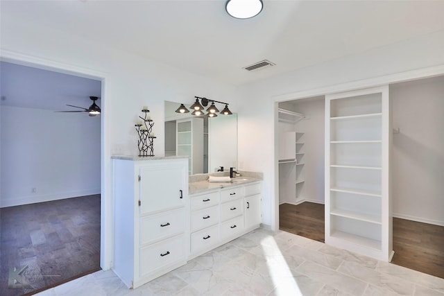 bathroom with vanity and ceiling fan