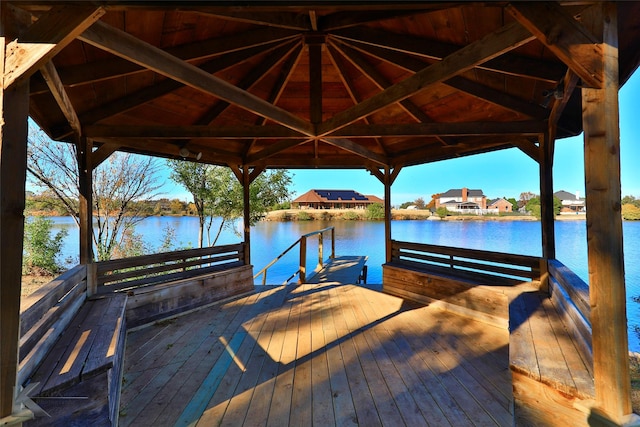 view of dock featuring a water view and a gazebo