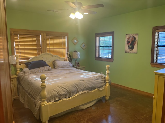 bedroom with multiple windows and ceiling fan