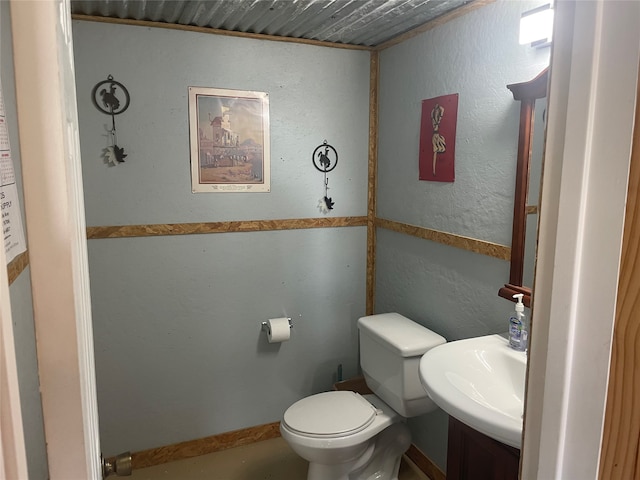 bathroom featuring wooden ceiling, vanity, and toilet