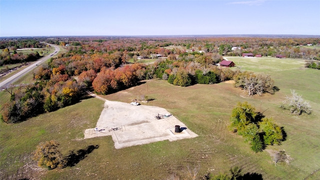 birds eye view of property with a rural view