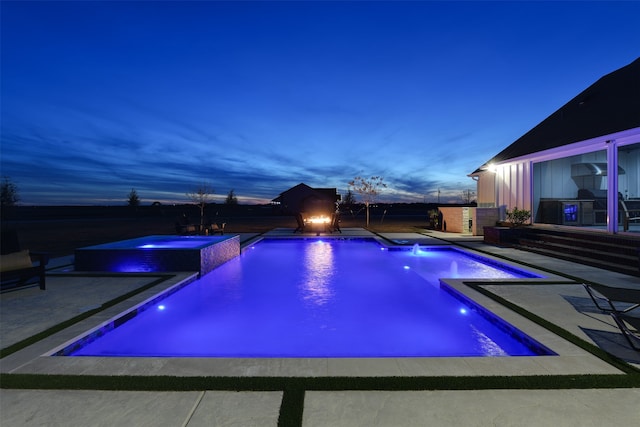 pool at dusk with a patio