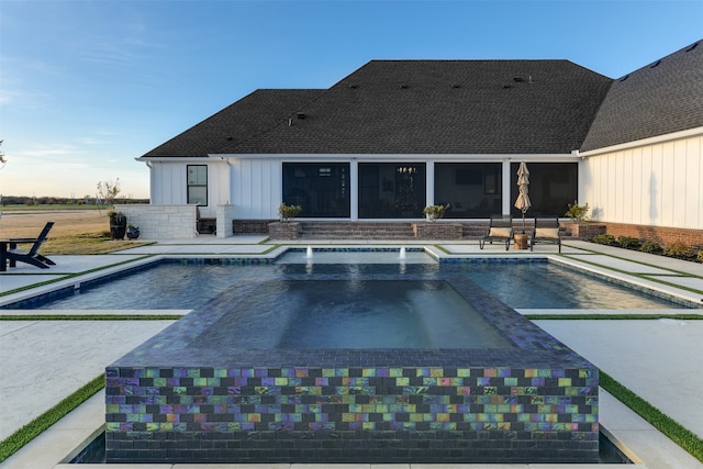 view of pool featuring an in ground hot tub and a patio area