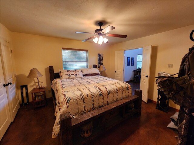 carpeted bedroom with multiple windows and ceiling fan