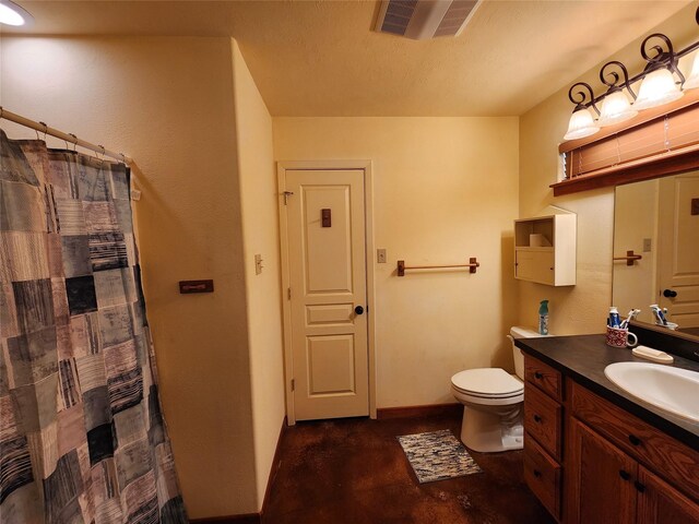 bathroom with toilet and oversized vanity