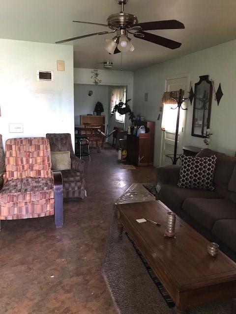 living room featuring ceiling fan