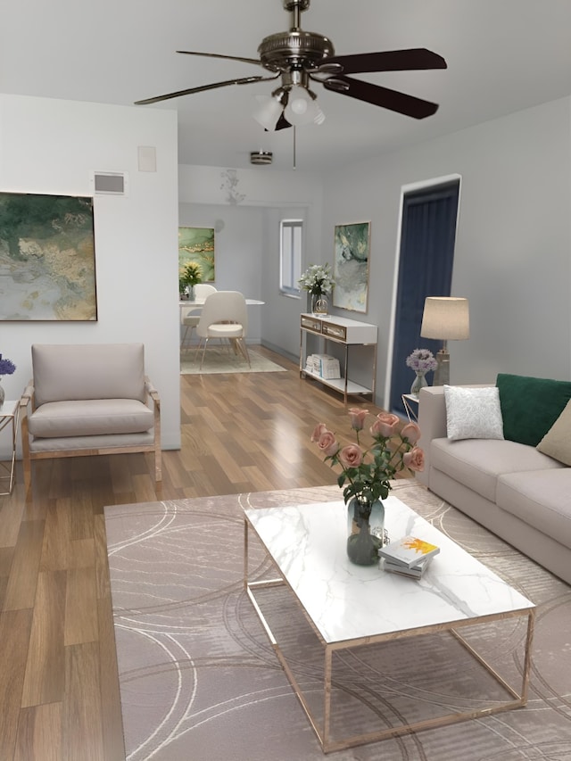 living room featuring ceiling fan and wood-type flooring