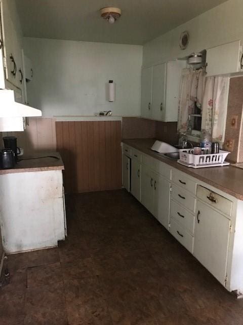 kitchen with white cabinetry and sink