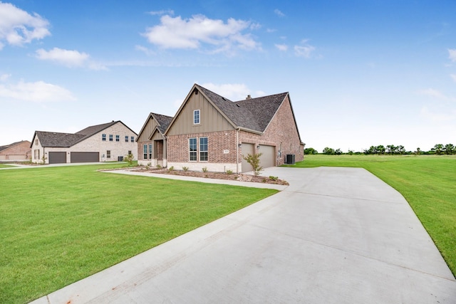 view of front of house featuring a garage, a front lawn, and central air condition unit