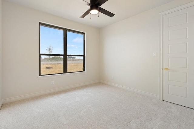 carpeted empty room with a healthy amount of sunlight and ceiling fan