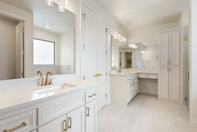 bathroom with vanity and tile flooring