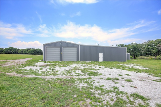 exterior space featuring an outdoor structure and a garage