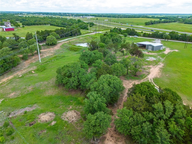 birds eye view of property with a rural view