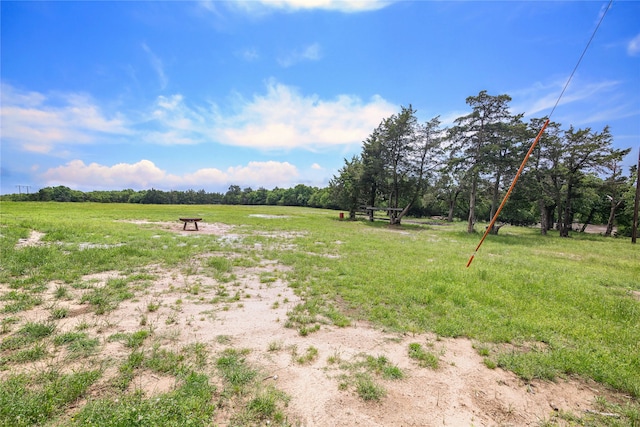 view of yard with a rural view