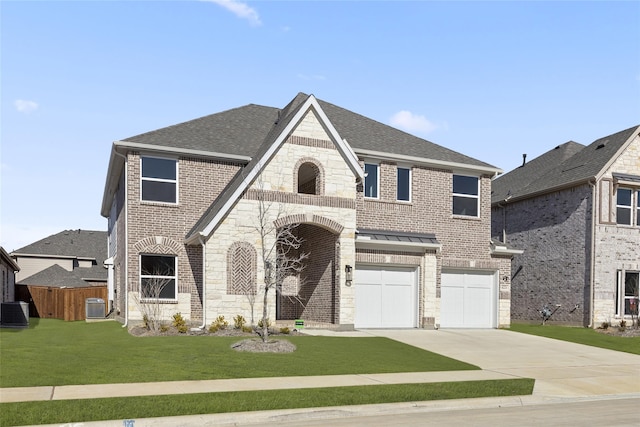 view of front of property with a garage, a front yard, and cooling unit