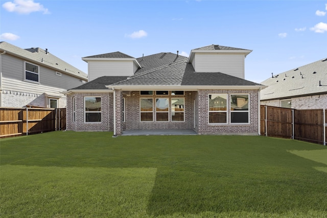 back of property featuring a patio area and a lawn